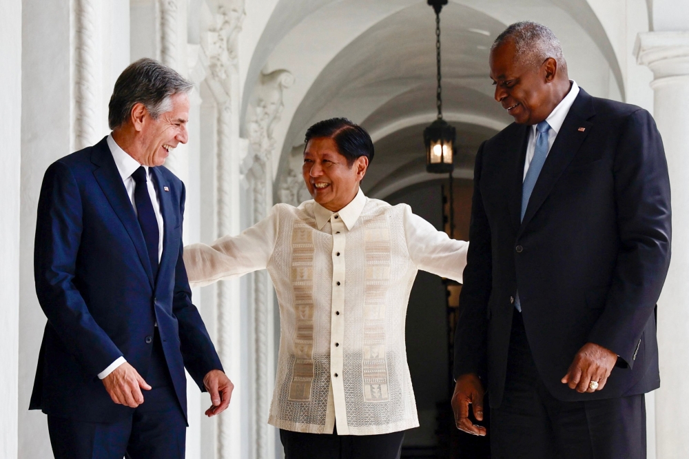 Philippines' President Ferdinand Marcos Jr. (C) talks to US Secretary of State Antony Blinken (L) and US Secretary of Defense Lloyd Austin during a courtesy visit at the Malacanang Palace in Manila on July 30, 2024. (Photo by Francis R. Malasig / Pool / AFP)
