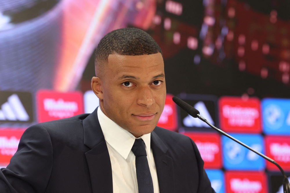 (Files) French forward Kylian Mbappe gives his first press conference as a Real Madrid player at the Santiago Bernabeu Stadium in Madrid on July 16, 2024. (Photo by Pierre-Philippe Marcou / AFP)
 