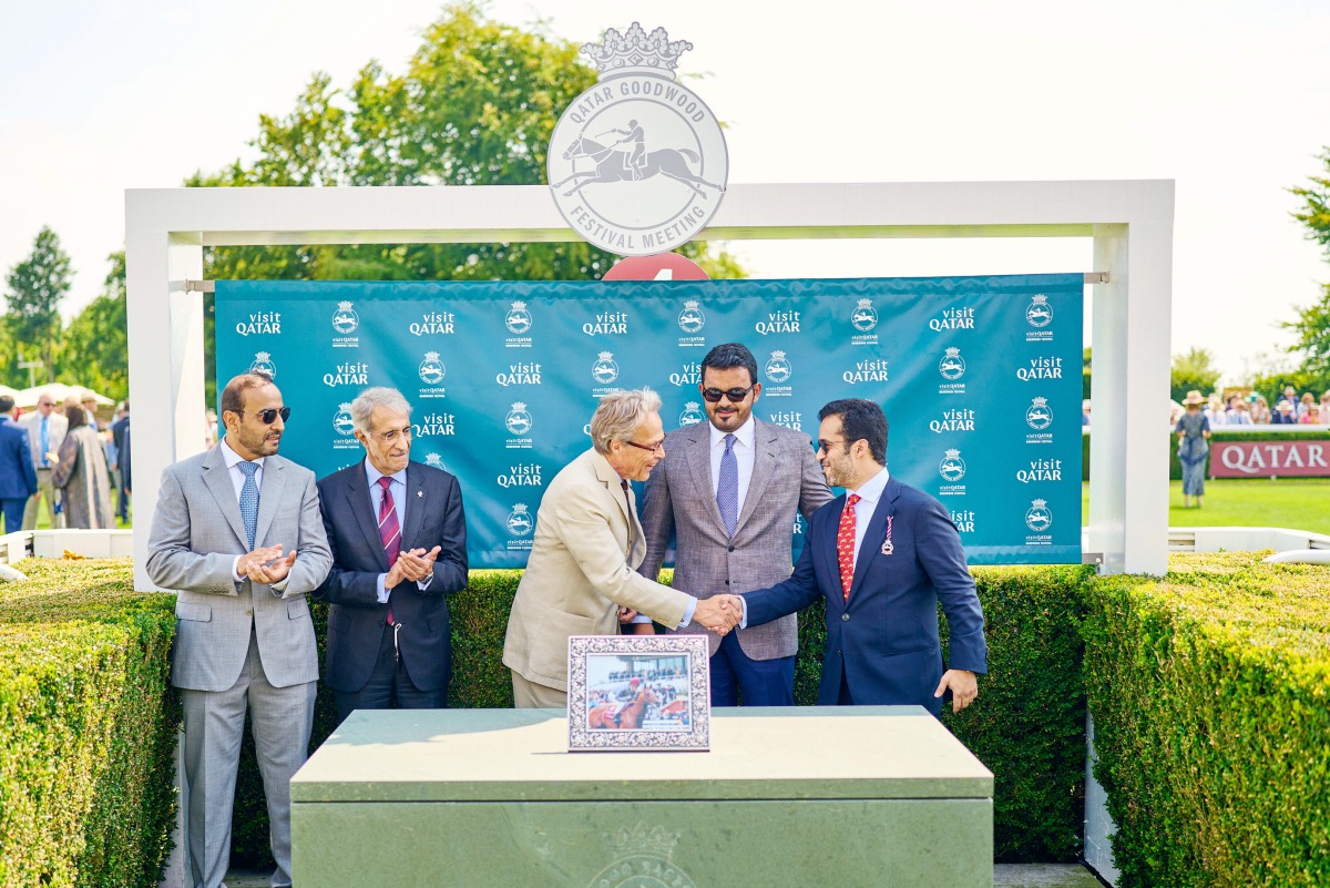 Qatar Olympic Committee President H E Sheikh Joaan bin Hamad Al Thani looks on as Qatar Tourism Chairman Saad bin Ali Al Kharji (right) shakes hands with the Duke of Richmond, Chairman of Goodwood Racecourse during the sponsorship signing ceremony. 