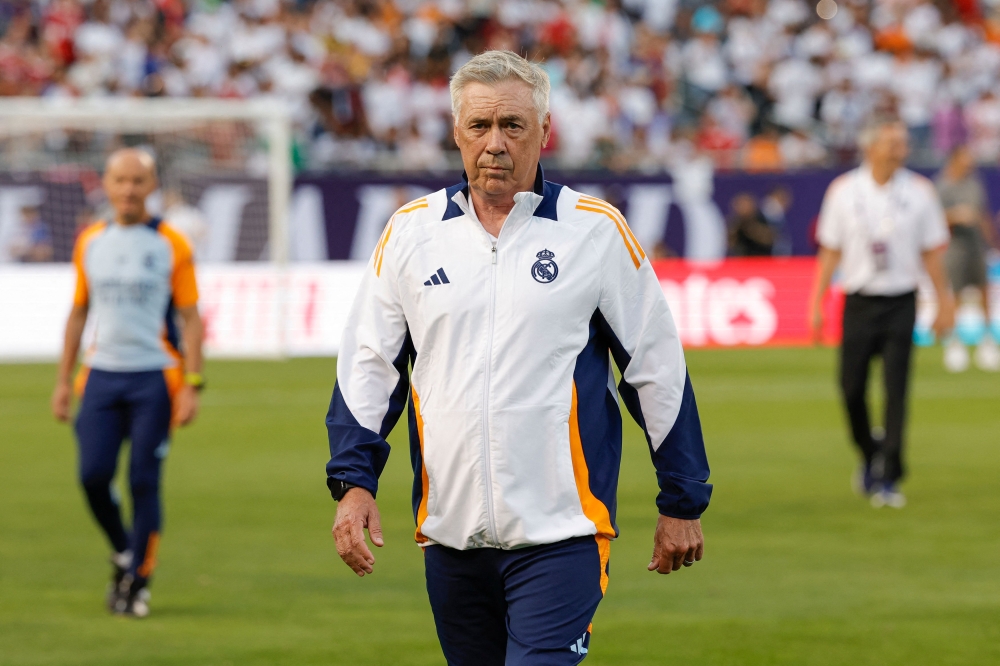 Real Madrid's Italian manager Carlo Ancelotti walks on the field before the pre-season club friendly football match between AC Milan and Real Madrid at Soldier Field in Chicago, Illinois, on July 31, 2024. (Photo by Kamil Krzaczynski / AFP)
