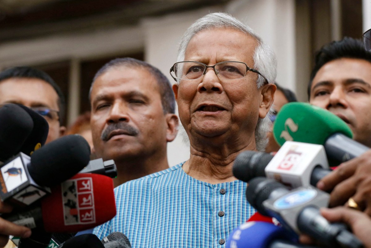 Bangladeshi Nobel peace laureate Muhammad Yunus addressing the media as he prepared to leave after filing an appeal for the extension of his bail at Labour Appellate Tribunal in Dhaka on March 3, 2024. Photo by REHMAN ASAD / AFP.