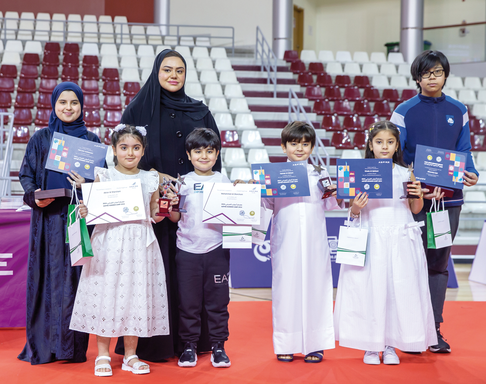 Kids receiving participation certificates during conclusion ceremony of Aspire Summer Camp 2024.
