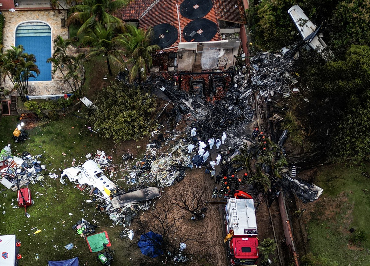 This photo shows an aerial view of the wreckage of an airplane that crashed with 61 people on board in Vinhedo, Sao Paulo State, Brazil, on August 10, 2024. (Photo by Nelson ALMEIDA / AFP)