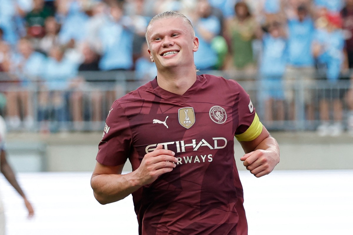 Manchester City's forward #09 Erling Haaland smiles after scoring his third goal during the second half of the pre-season club friendly football match between Chelsea FC and Manchester City FC at Ohio Stadium in Columbus, Ohio on August 3 2024. (Photo by KAMIL KRZACZYNSKI / AFP)