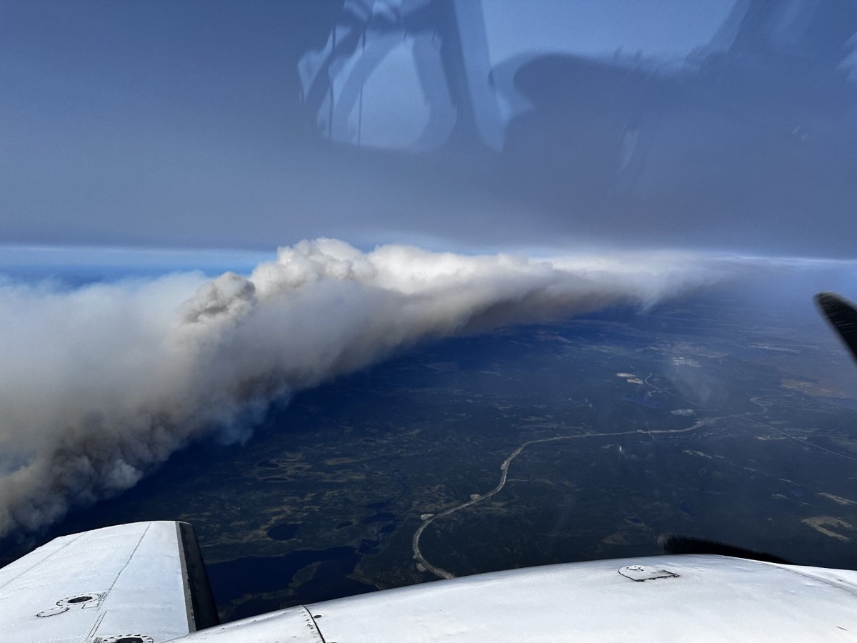 This photo taken and handout on July 12, 2024 shows an aerial view of an out-of-control wildfire near the northeastern town of Wabush in Canada. Photo by Simon Contant / AFP

