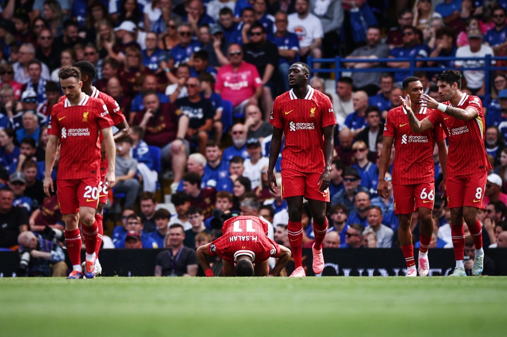 Liverpool's Egyptian striker #11 Mohamed Salah celebrates after scoring his team second goal during the English Premier League football match between Ipswich Town and Liverpool at Portman Road in Ipswich, eastern England on August 17, 2024. (Photo by HENRY NICHOLLS / AFP)