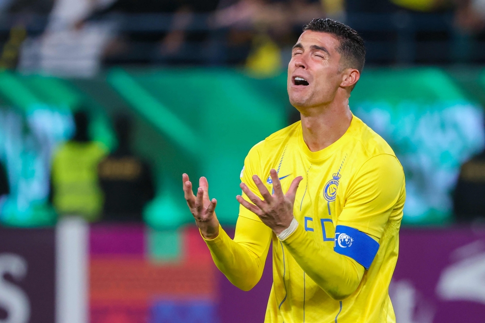 (FILES) Nassr's Portuguese forward #07 Cristiano Ronaldo reacts during the AFC Champions League football match between Saudi Arabia's Al-Nassr and UAE's Al-Ain at Al-Awal Park Stadium in Riyadh on March 11, 2024. (Photo by Fayez Nureldine / AFP)

