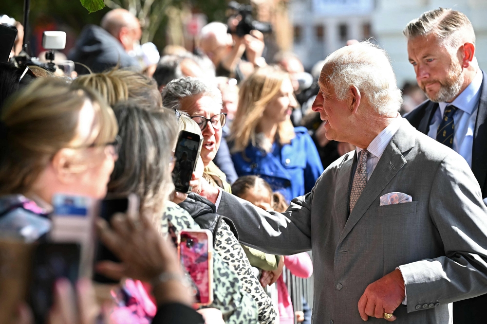 Britain's King Charles III shakes hands with members of the public after visiting the Town Hall in Southport, northwest England, on August 20, 2024, where he met with members of the local community following the July 29 attack at a childrens' dance party. (Photo by Paul ELLIS / POOL / AFP)

