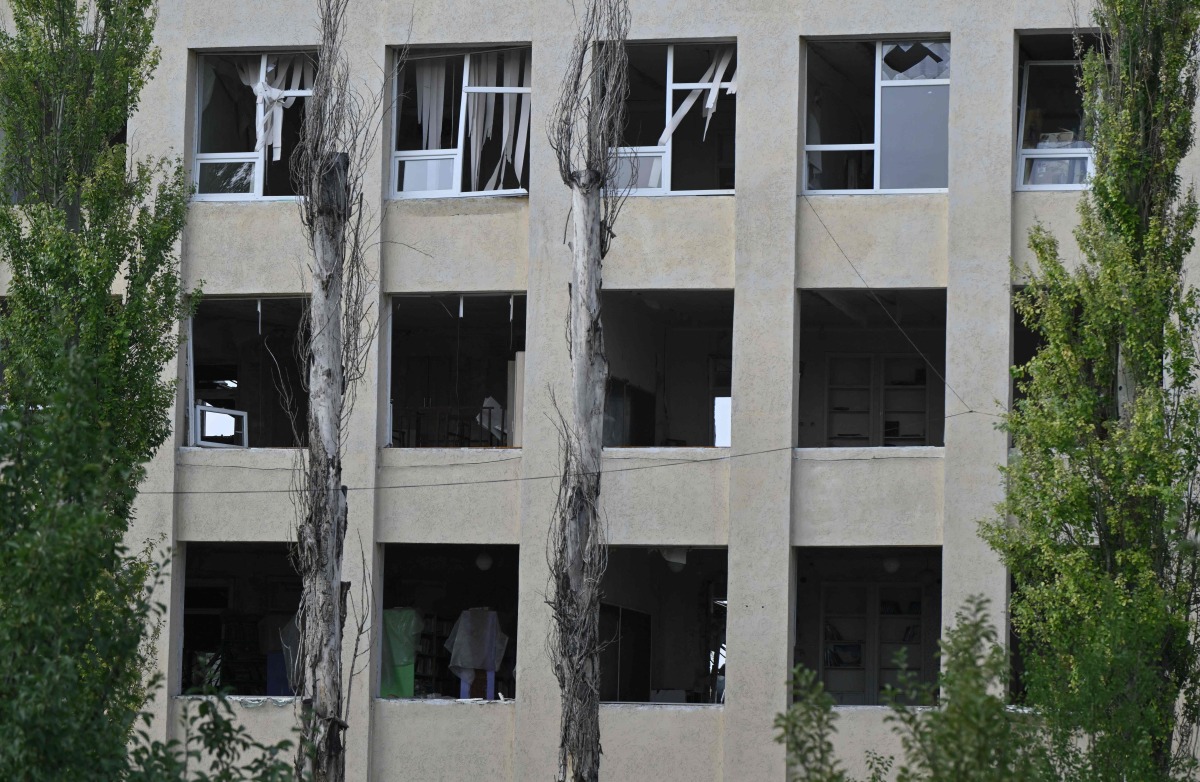 This photograph shows a destroyed school building in the town of Myrnohrad on August 26, 2024. (Photo by Genya SAVILOV / AFP)
