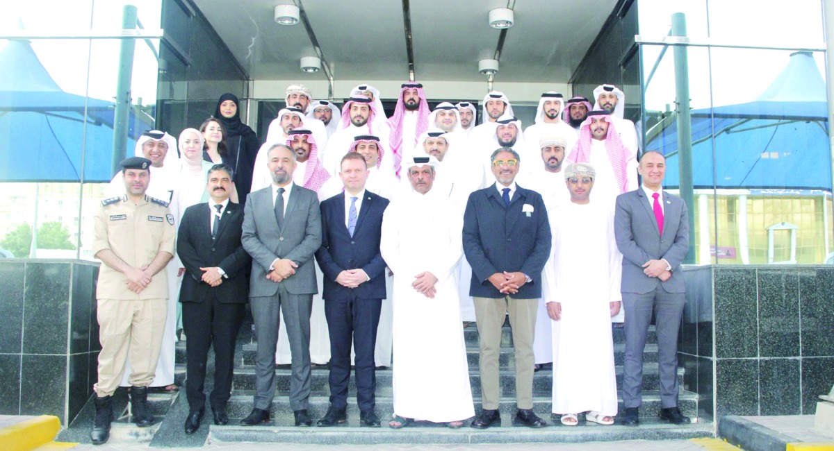 Participants in a group photo during the event in Doha.