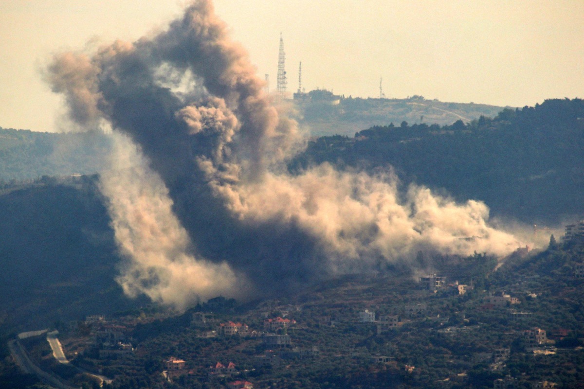 Smoke billows following an Israeli airstrike in the southern Lebanese village of Adaisseh near the border with Israel on August 28, 2024. (Photo by Rabih DAHER / AFP)
