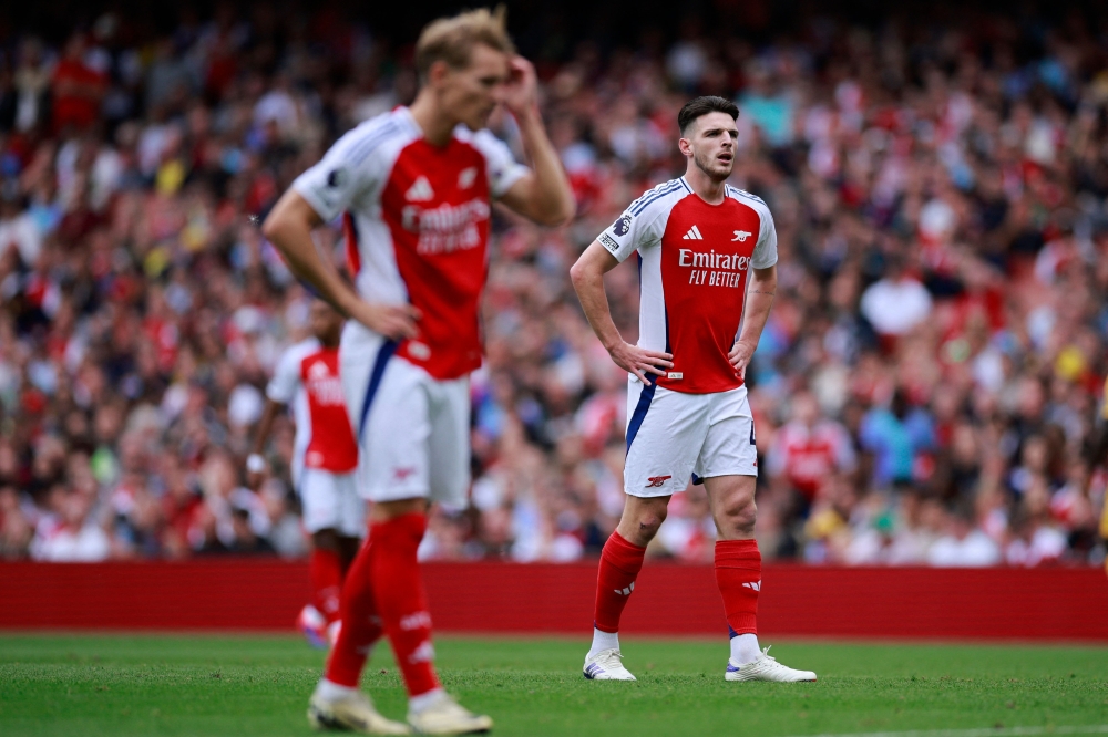 Arsenal's English midfielder #41 Declan Rice reacts during the English Premier League football match between Arsenal and Brighton and Hove Albion at the Emirates Stadium in London on August 31, 2024. (Photo by BENJAMIN CREMEL / AFP)