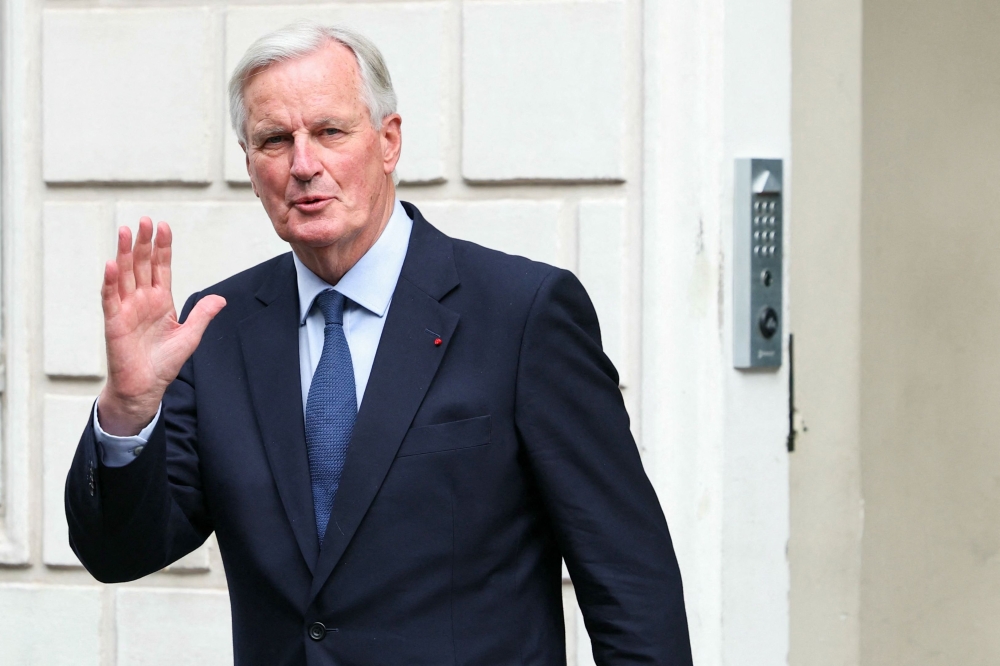 Newly appointed Prime minister Michel Barnier gestures before the handover ceremony at the Hotel Matignon in Paris, on September 5, 2024. (Photo by Thomas Samson / AFP)
