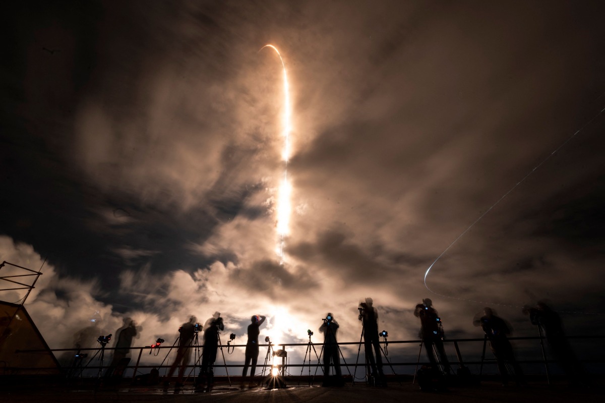 A SpaceX Falcon 9 rocket with the Crew Dragon Resilience capsule, carrying the crew of the Polaris Dawn Mission, lifts off from Launch Complex 39A at Kennedy Space Center in Cape Canaveral, Florida, on September 10, 2024. (Photo by CHANDAN KHANNA / AFP)

