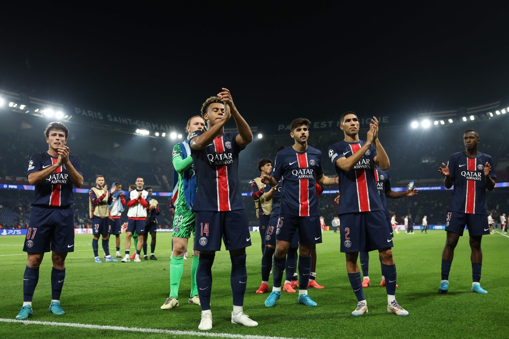 Paris Saint-Germain's players acknowledge the crowd at the end of the UEFA Champions League 1st round day 1 football match between Paris Saint-Germain (PSG) and Girona FC at the Parc des Princes Stadium, in Paris, on September 18, 2024. (Photo by Franck Fife / AFP)