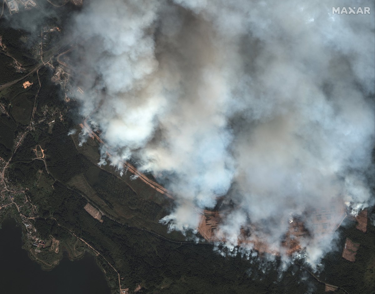 This handout satellite image taken and released on September 18, 2024 by Maxar Technologies shows smoke billowing over an ammunition depot in Toropets, Russian Tver region, after it was struck by Ukrainian drones. Photo by Handout / Satellite image ©2024 Maxar Technologies / AFP.