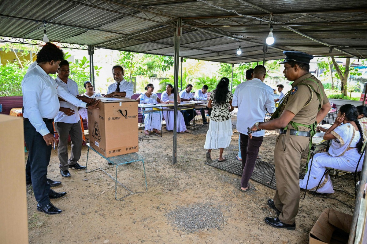  Election officials seal a ballot box at the end of voting in Sri Lanka's presidential election at a polling station in Colombo on September 21, 2024. Cash-strapped Sri Lanka voted for its next president on September 21 in an effective referendum on an unpopular International Monetary Fund austerity plan enacted after the island nation's unprecedented financial crisis. (Photo by Ishara S.KODIKARA / AFP)