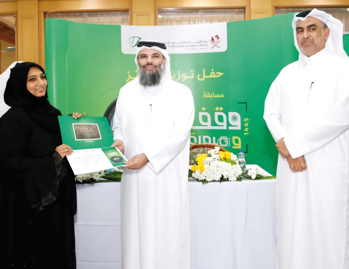 Undersecretary of the Ministry of Awqaf and Islamic Affairs Dr. Sheikh Khalid bin Mohammed bin Ghanem Al Thani (centre) honouring a winner.
