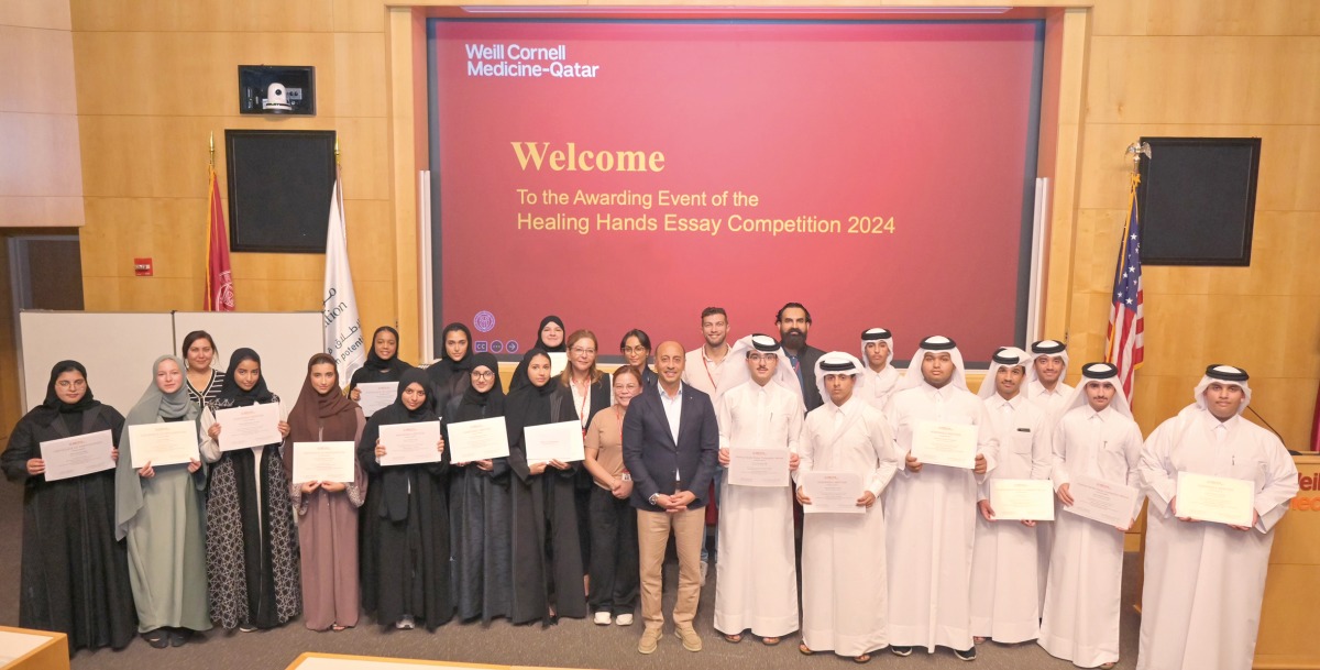 Participants in the WCM-Q Healing Hands essay contest with members of the faculty and staff.