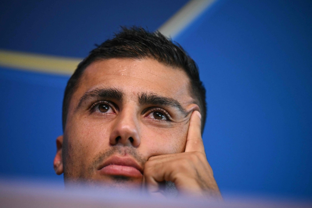 (FILES) Manchester City's Spanish midfielder #16 Rodri reacts during a press conference at the Manchester City's training ground, in Manchester, north-west England, on September 17, 2024, on the eve of their UEFA Champions League football match against Inter Milan. (Photo by Oli SCARFF / AFP)

