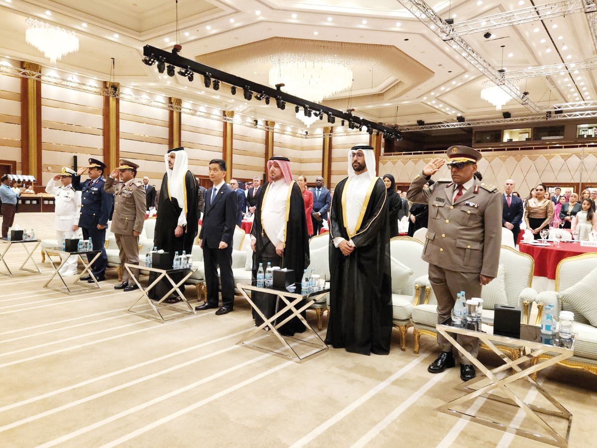 Minister of Commerce and Industry H E Sheikh Mohammed bin Hamad bin Qassim Al Thani; Director of the Protocol Department at the Ministry of Foreign Affairs H E Ibrahim Yousif Abdullah Fakhro; and Ambassador of China to Qatar H E Cao Xiaolin with other dignitaries and guests during a reception to celebrate 75th anniversary of the founding of the People’s Republic of China in Doha, yesterday.