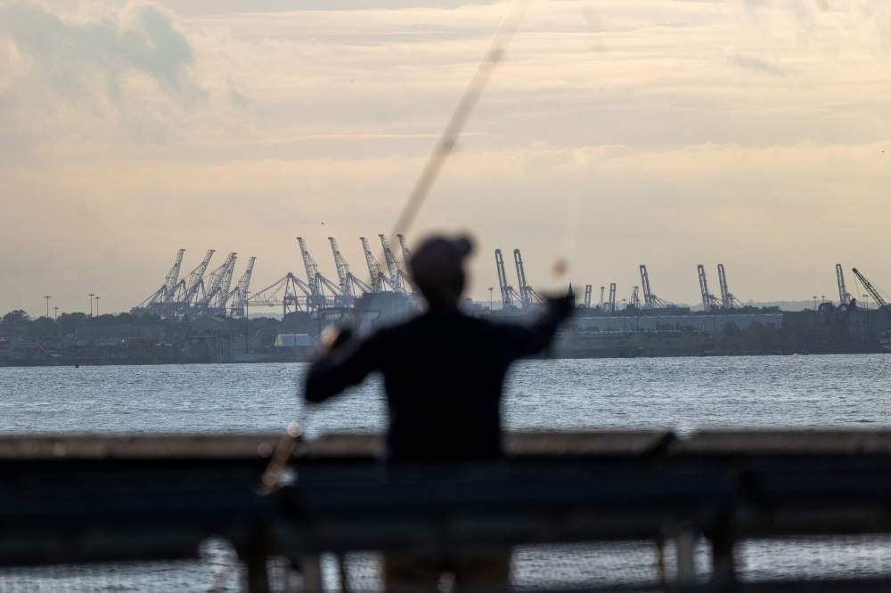 Cranes used for shipping containers rise from the Port of Newark on September 30, 2024 in New York City. (Photo by SPENCER PLATT / GETTY IMAGES NORTH AMERICA / Getty Images via AFP)
