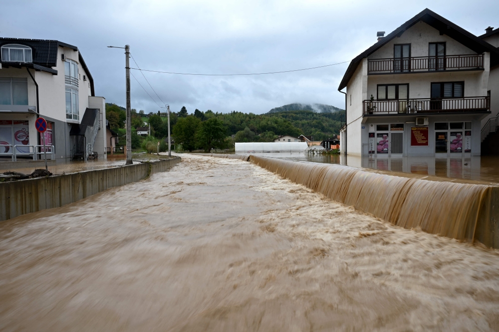 A picture taken in the town of Kiseljak, about twenty kilometres west of Sarajevo on October 4, 2024 shows a flooded street following heavy rains. Photo by Elvis BARUKCIC / AFP
