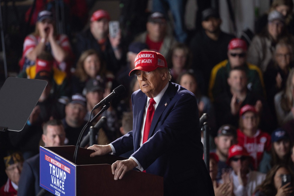 Republican presidential nominee former President Donald Trump speaks during a rally at Dodge County Airport on October 06, 2024 in Juneau, Wisconsin (Photo by SCOTT OLSON / GETTY IMAGES NORTH AMERICA / Getty Images via AFP)
