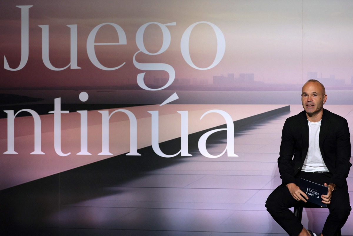 Spanish footballer Andres Iniesta talks during an event to celebrate his career at the America's Cup Experience venue in Barcelona on October 8, 2024. (Photo by LLUIS GENE / AFP)
