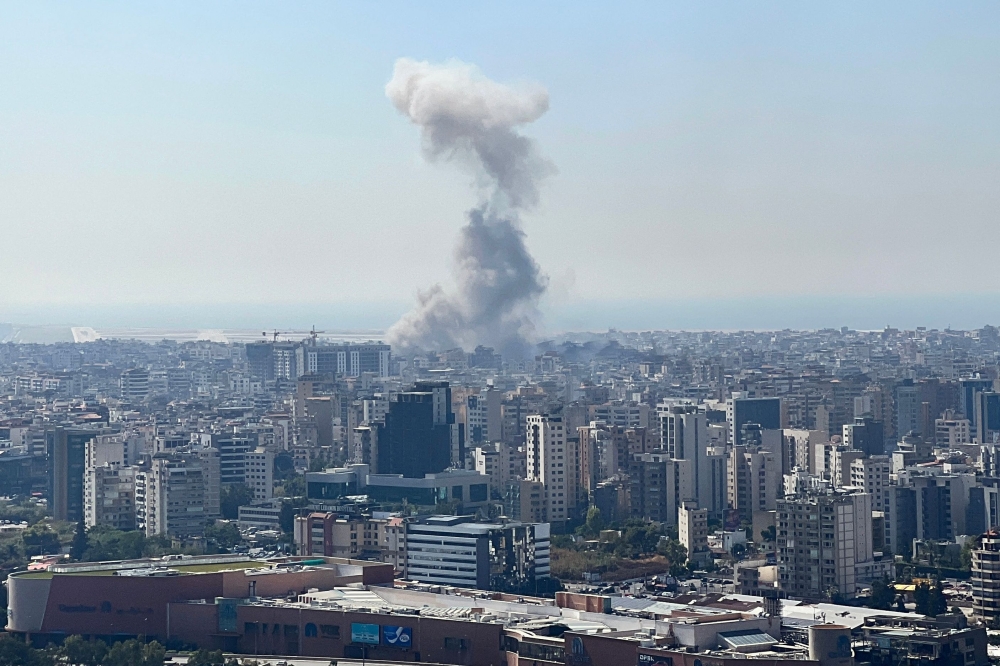 Smoke rises from the site of an Israeli airstrike that targeted a neighbourhood in Beirut's southern suburbs on October 8, 2024. (Photo by Mohammad Abou Al Ainain / AFP)