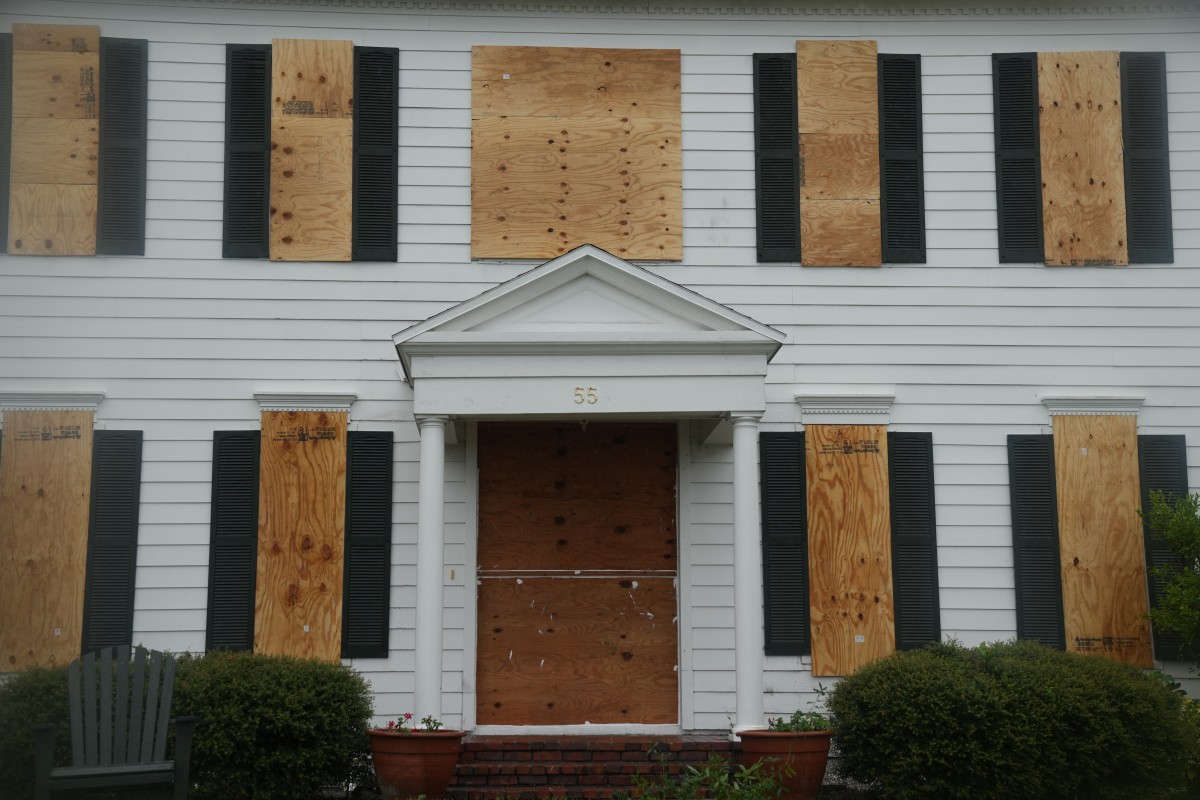 A boarded up house for sale in the the front yard in Dunedin ahead of Hurricane Milton's expected landfall tonight on October 9, 2024 in Florida. Photo by Bryan R. SMITH / AFP