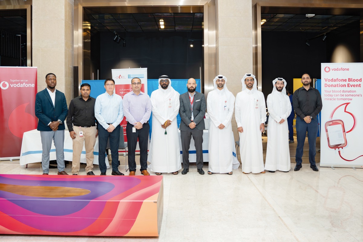 Vodafone Qatar employees participating in a blood donation drive.
