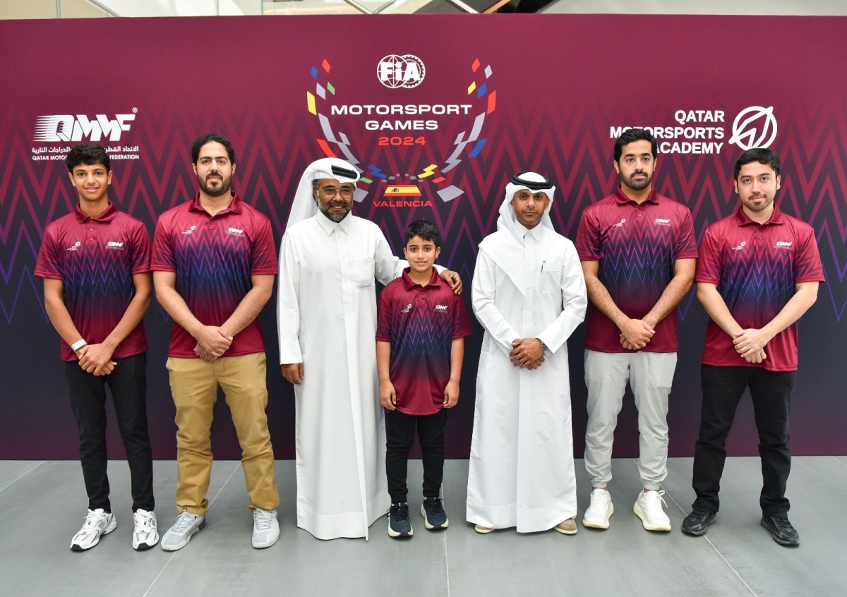 President of the Qatar Motor & Motorcycle Federation (QMMF) and Lusail International Circuit (LIC) Abdulrahman bin Abdullatif Al Mannai and QMMF Executive Director and CEO of LIC Amro Al Hamad pose with members of Team Qatar set to make debut at FIA Motorsport Games in Valencia, Spain.