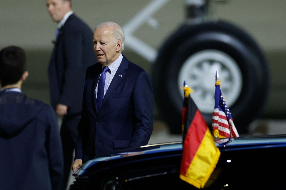 US President Joe Biden is pictured upon arrival at Berlin-Brandenburg Airport (BER) in Schoenefeld, southeast of the German capital, late on October 17, 2024. (Photo by Odd Andersen / AFP)