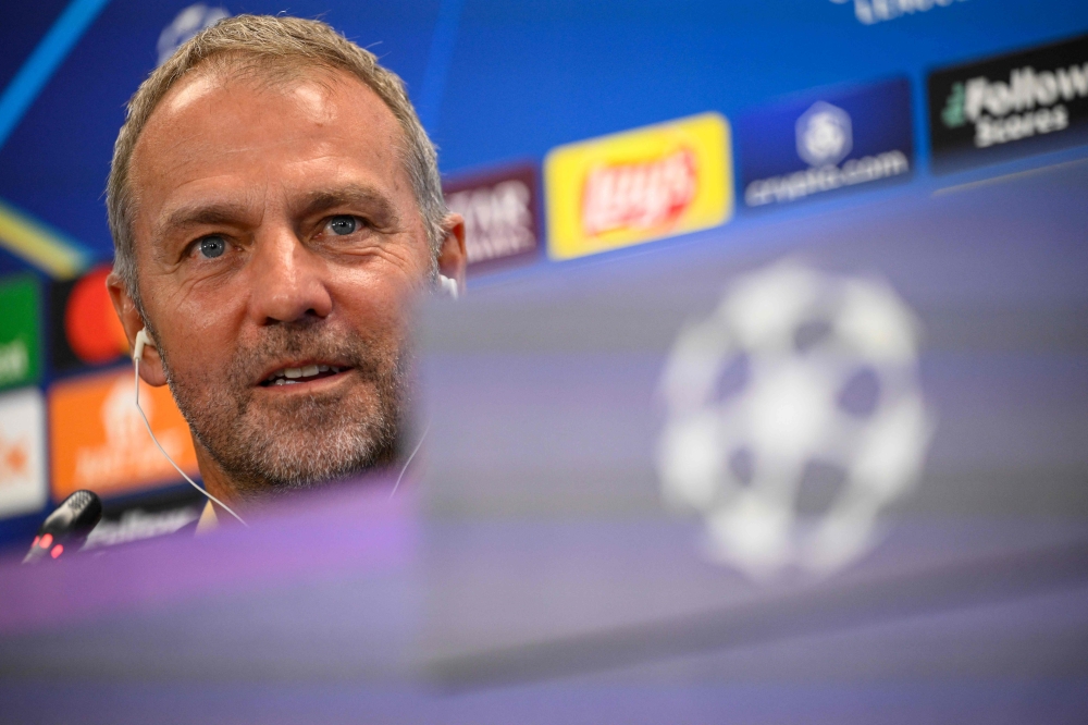 Barcelona's German coach Hans-Dieter Flick gives a press conference on the eve of the UEFA Champions League, league phase day 3 football match between FC Barcelona and FC Bayern Munich at the Joan Gamper training ground in Sant Joan Despi, near Barcelona, on October 22, 2024. (Photo by Josep LAGO / AFP)