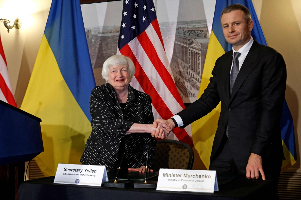 US Treasury Secretary Janet Yellen (left) and Ukrainian Minister of Finance Sergii Marchenko at the conclusion of a signing ceremony at the Treasury Department on October 23, 2024 in Washington, DC. ( Photo by Chip Somodevilla/Getty Images via AFP)
