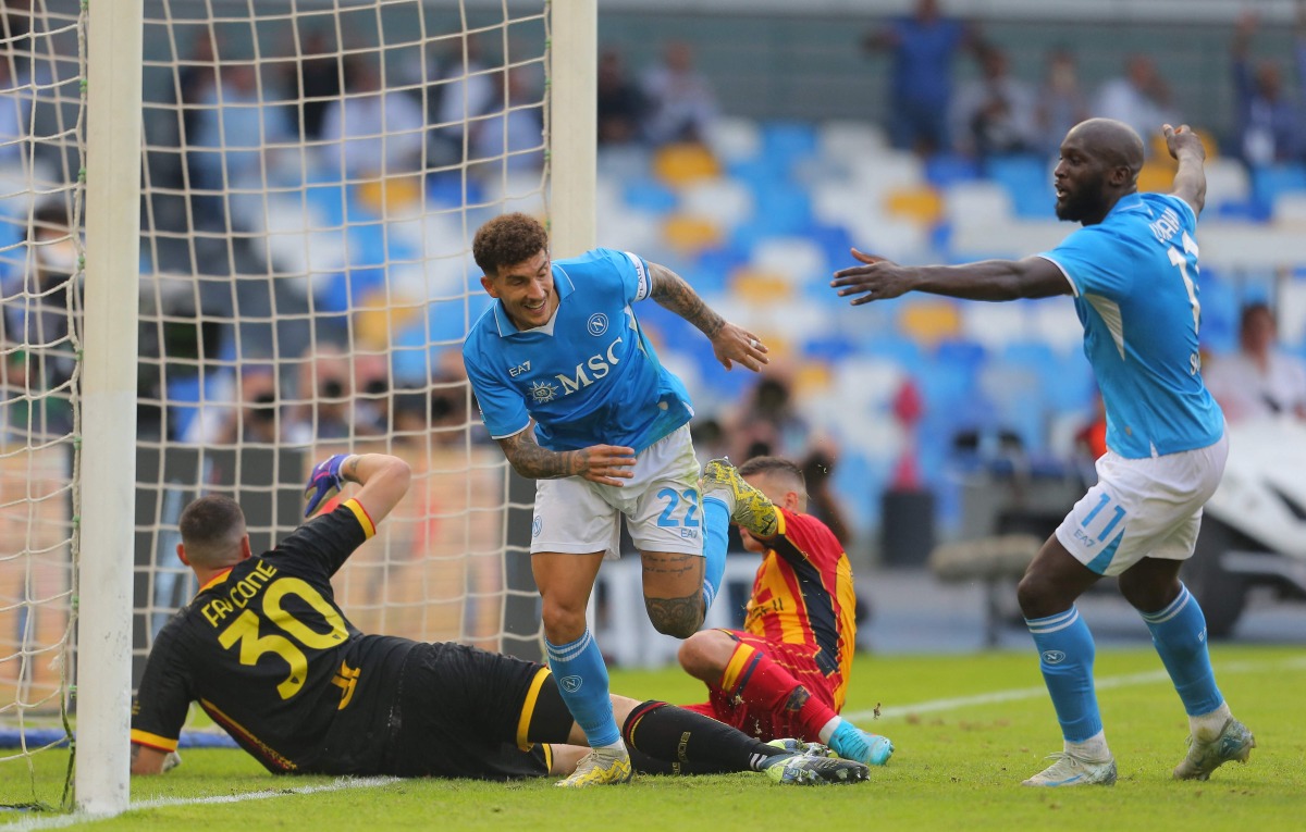 Napoli's Italian defender #22 Giovanni Di Lorenzo celebrates with Napoli's Belgian forward #11 Romelu Lukaku after scoring against Lecce's Italian goalkeeper #30 Wladimiro Falcone during the Italian Serie A football match between Napoli and Lecce at the Diego Armando Maradona stadium in Naples on October 26, 2024. (Photo by CARLO HERMANN / AFP)
