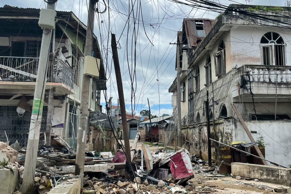 This photo taken on August 10, 2024 shows destroyed and damaged buildings in Lashio in Myanmar's northern Shan State, following fighting between Myanmar's military and Myanmar National Democratic Alliance Army (MNDAA) in the region. (Photo by AFP)

