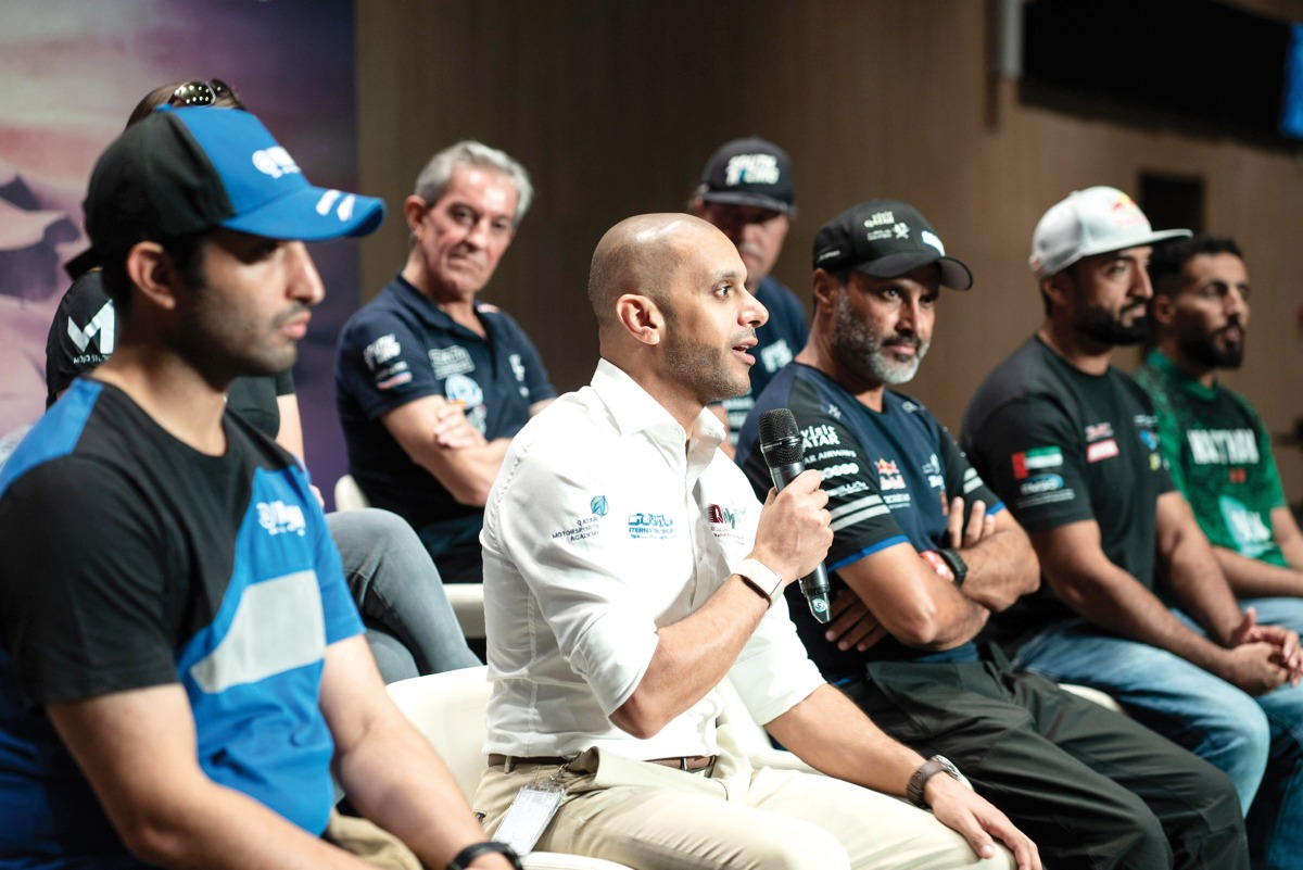 QMMF Executive Director Amro Al Hamad speaks during a pre-event press conference yesterday. He was joined by Qatar rally ace Nasser Saleh Al Attiyah and other competitors.  
