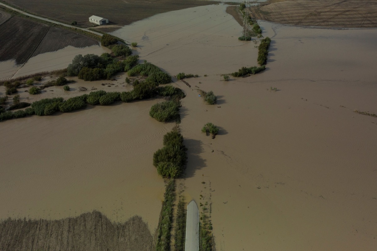 An aerial picture shows a road flooded in Arcos de la Frontera, near Cadiz, on October 31, 2024, after heavy rains hit southern Spain. (Photo by JORGE GUERRERO / AFP)
