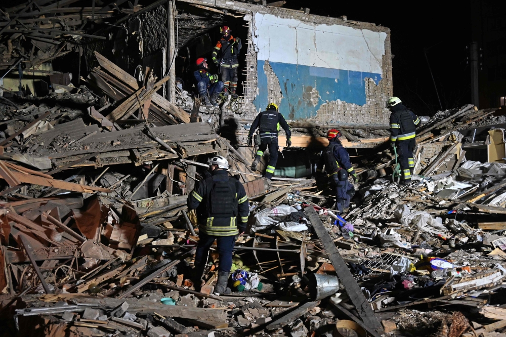 Rescuers of the State Emergency Service inspect the remains of a residential building after a strike in Kharkiv, on November 1, 2024. Photo by SERGEY BOBOK / AFP