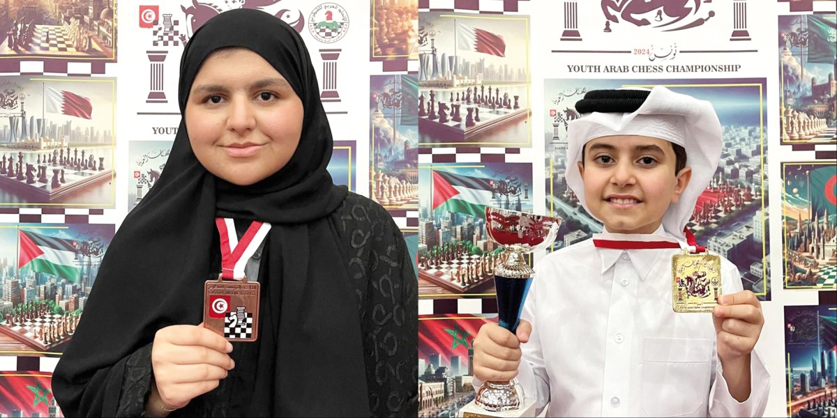 Lian Al Qassabi (L) and Khaled Al Jumaat (R), gold medal holders in the U-10 category of the Arab Chess Championships for age groups 8 to 20 years, in Sousse, Tunisia. 