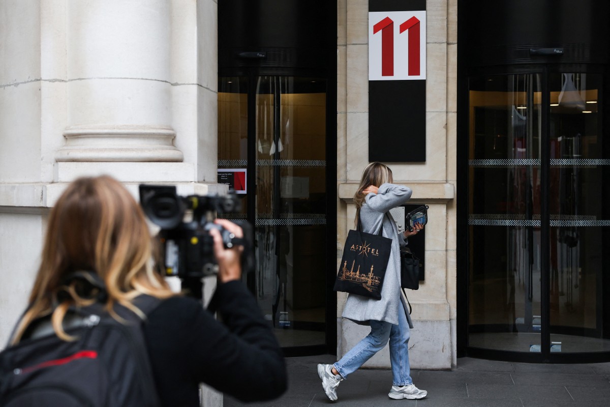 A pedestrian walks past the Paris offices of the Netflix streaming company at Square Edouard VII in Paris on November 5, 2024. Photo by Ian LANGSDON / AFP.