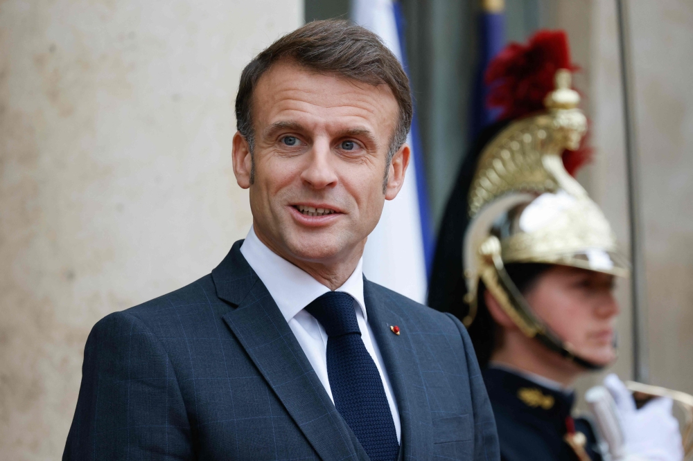 French President Emmanuel Macron looks on as he attends Kazakhstan's president arriving at the Elysee presidential palace prior to a meeting with French president as part of his state visit to France in Paris, on November 5, 2024. (Photo by Ludovic Marin / AFP)