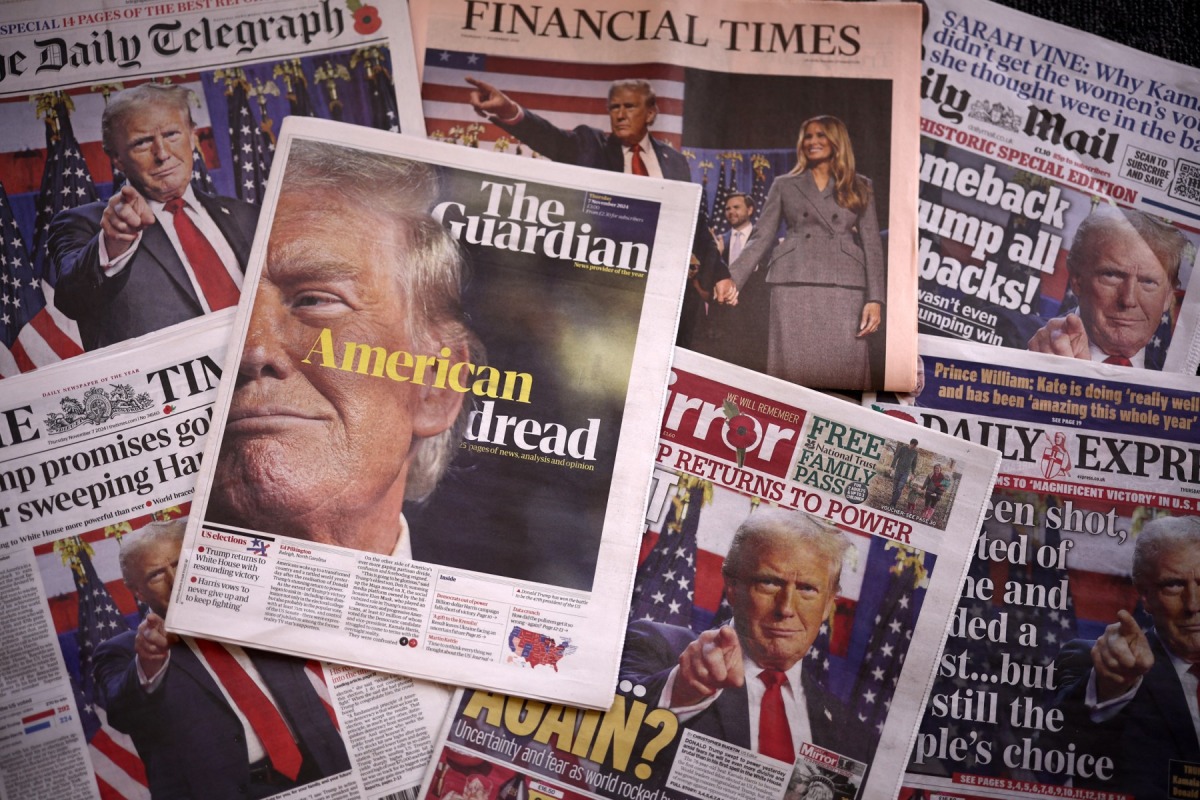 A picture taken in London on November 7, 2024 shows the frontpages of some of Britain's national newspapers about the re-election of US President-elect Donald Trump. Photo by HENRY NICHOLLS / AFP.