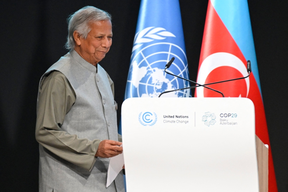 Bangladesh's interim leader Muhammad Yunus gives a speech during the United Nations Climate Change Conference (COP29) in Baku on November 13, 2024. (Photo by Alexander Nemenov / AFP)
