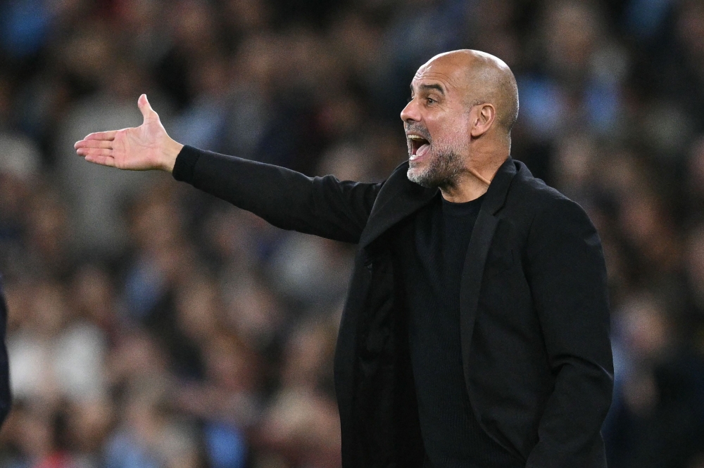 Manchester City's Spanish manager Pep Guardiola gestures on the touchline during the UEFA Champions League, league phase football match between Manchester City and Inter Milan at the Etihad stadium, in Manchester, north-west England, on September 18, 2024. (Photo by Oli Scarff / AFP)