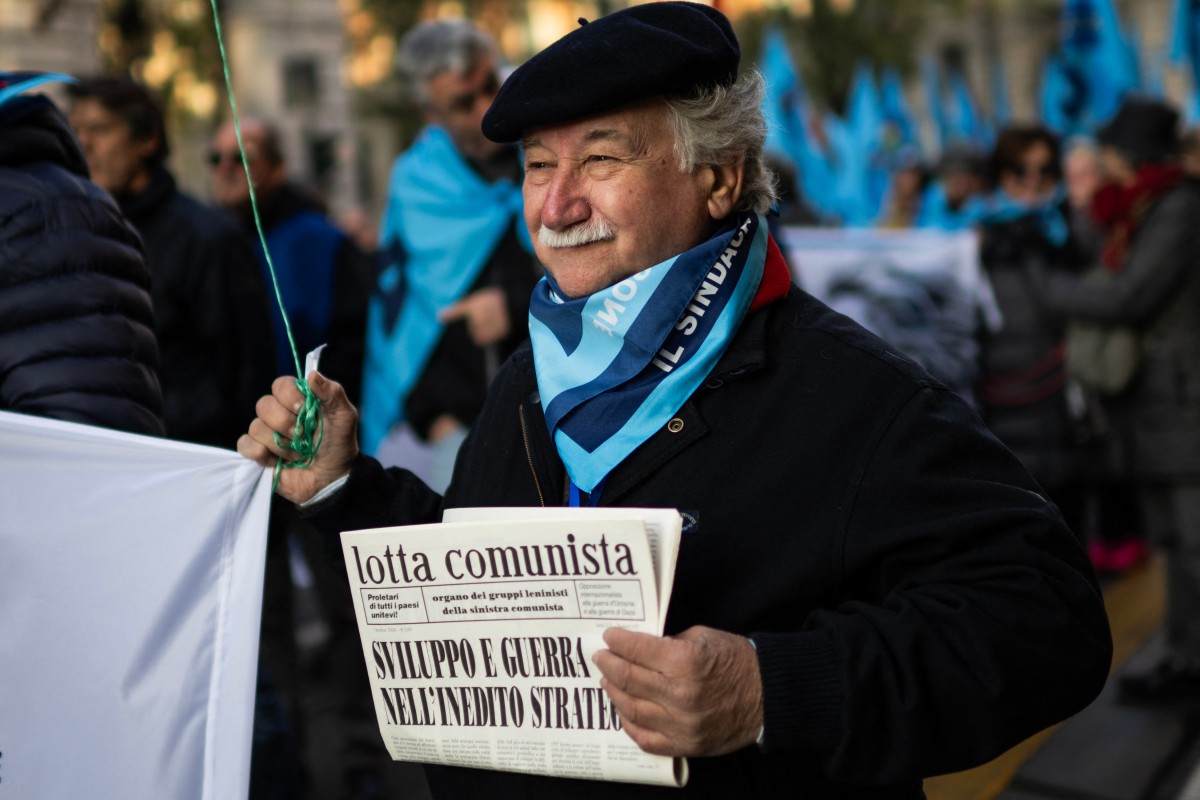 A protester holds a copy of the monthly 