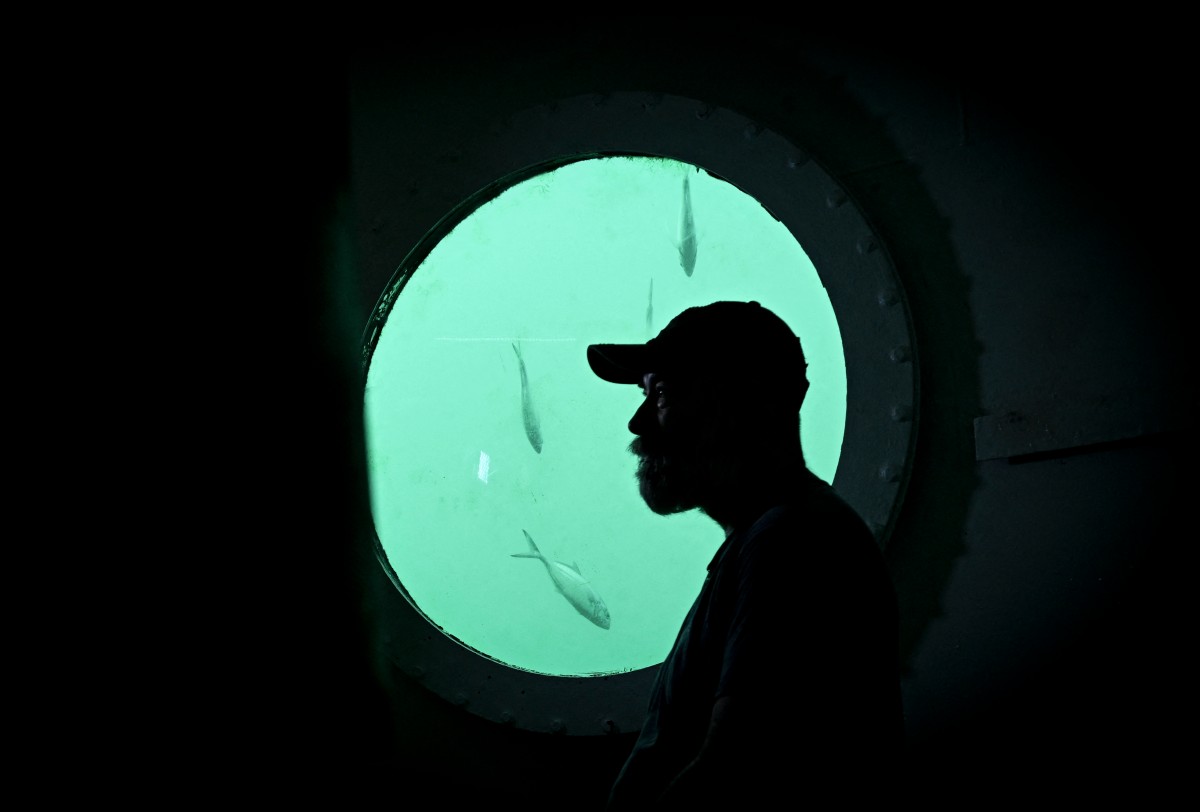 German aerospace engineer Rudiger Koch, 59, is pictured inside an underwater room off the coast of Puerto Lindo, Panama, on November 26, 2024. Photo by MARTIN BERNETTI / AFP