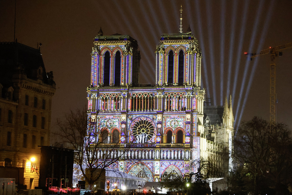 This photograph shows video mapping on the facade of Notre-Dame de Paris cathedral a few days before its reopening after reconstruction following the fire on April 15, 2019 when it was devastated, in Paris on December 5, 2024. Photo by Ludovic MARIN / AFP.